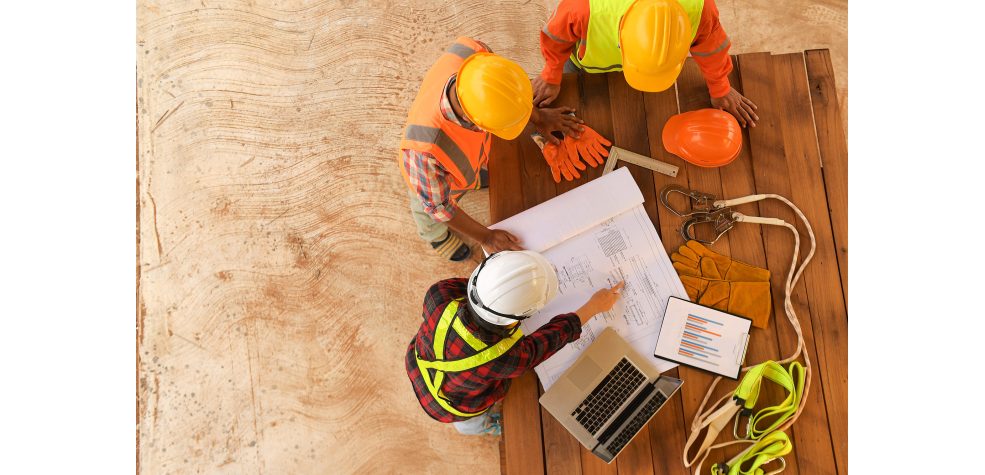 Contractors reviewing floorplan